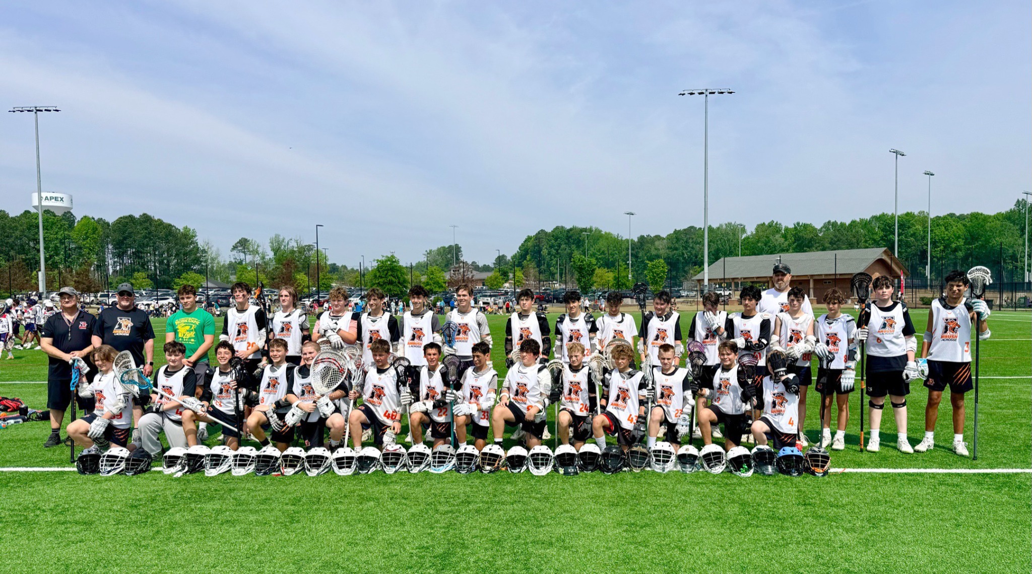 Ambush Lacrosse boys lacrosse team gathered on the field in Raleigh, NC